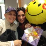 Photo of Laura with a smilie balloon